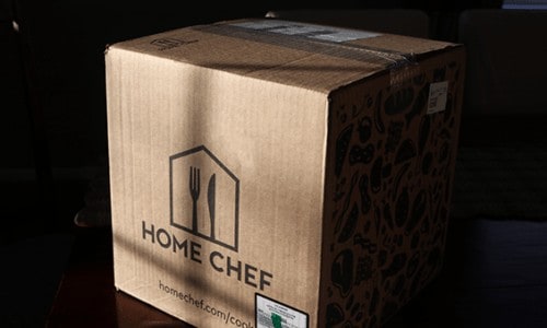 Home Chef delivery box filled with meal kit sitting on