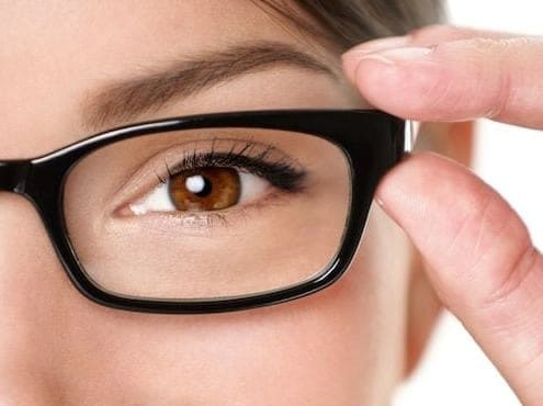 A close up of a person wearing glasses