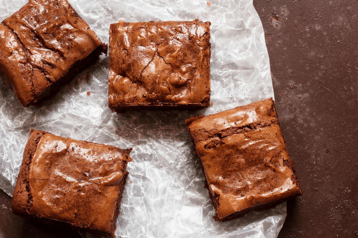 moist brownies on parchment paper