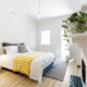 house guest room bright white walls light window houseplant bed