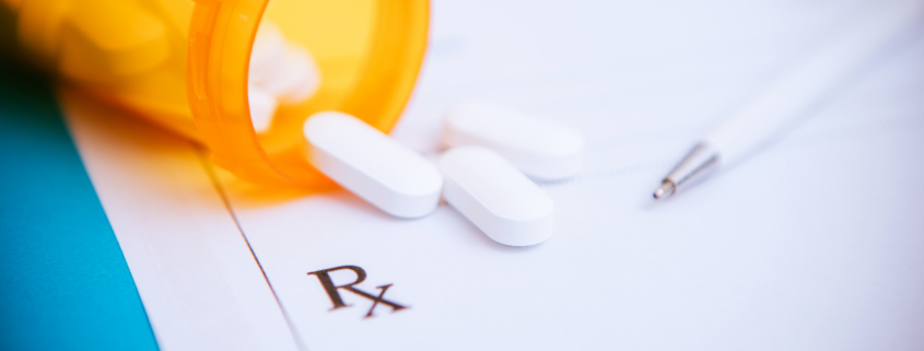 prescription drug costs spilling onto notepad RX