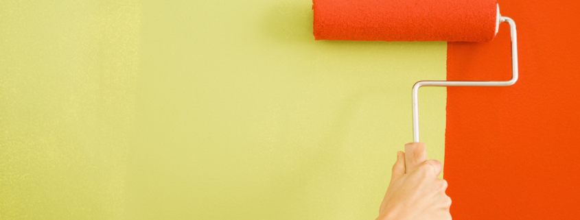 inexpensive room decor chartreuse and orange paint roller female hand