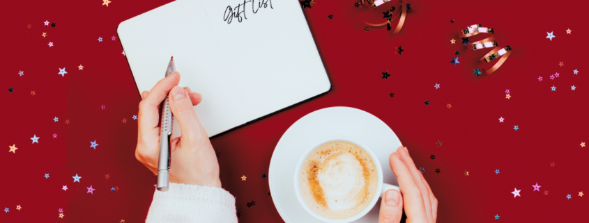 debt-free christmas debt female hands holding coffee mug and pen christmas planning gift list