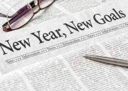 news you can use january 2025. News paper with pen and glasses on desk