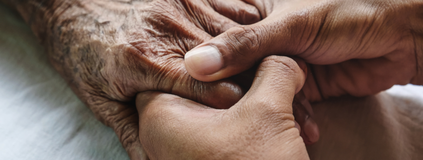 caregiving resources female hand holding elderly female hand