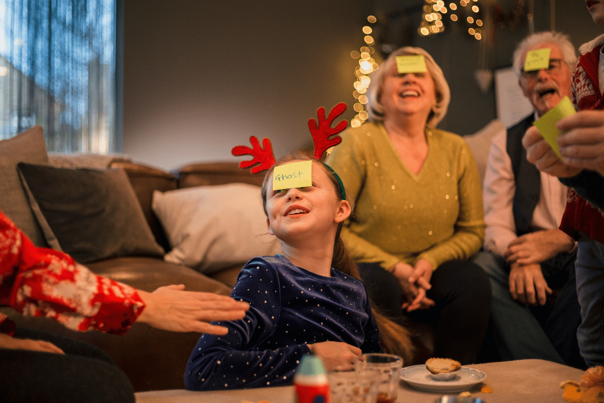 family christmas party heads up post it notes on foreheads