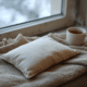 DIY rice heating pack next to cup of coffee sitting on blanket with winter window