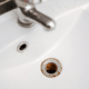 rust stains around a sink drain