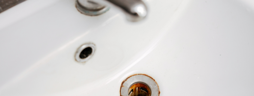 rust stains around a sink drain