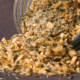 homemade garlic seasoning blend pouring out of glass jar