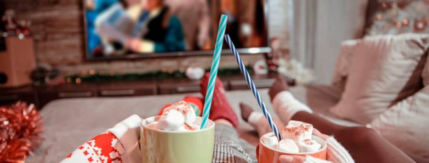 Christmas movie trivia quiz cups of hot cocoa with whipped cream