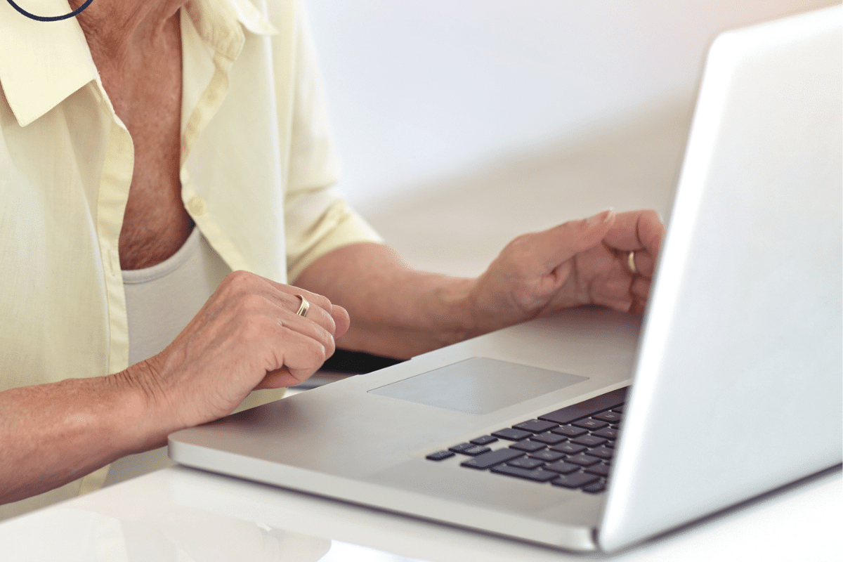 older woman looking at laptop