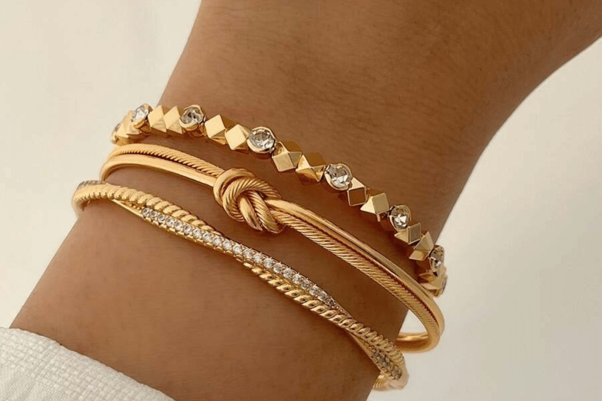 woman wearing gold bracelets jewelry sales deals in february
