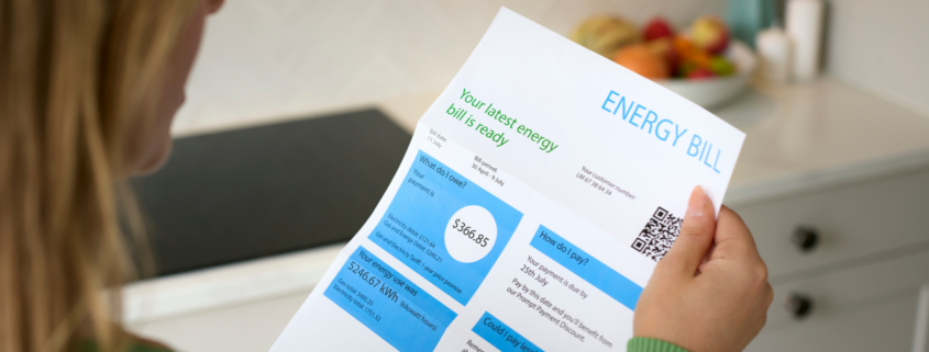 woman holding energy bill 15 minute weekend projects to reduce utility bill costs