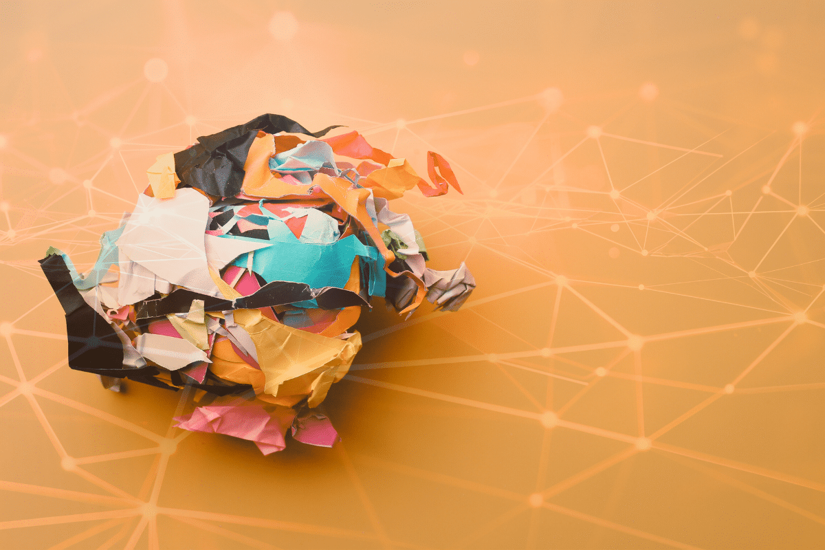 mental clutter crumpled up ball of construction paper