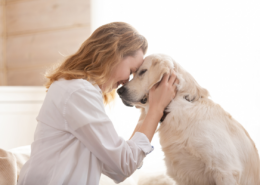 woman snuggling adult dog emergency plan for pets