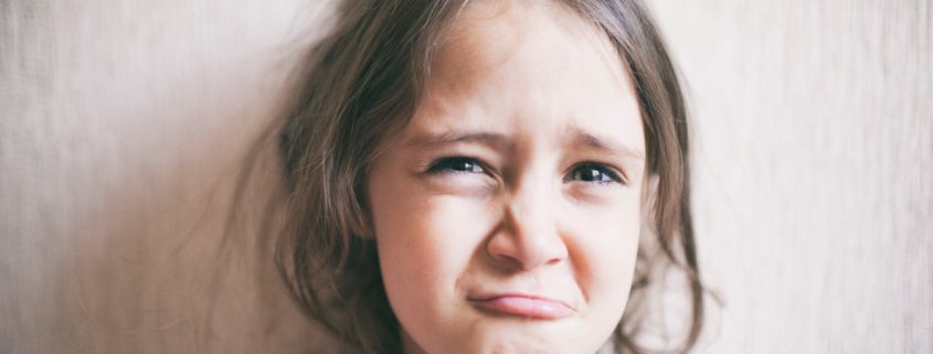 how to stop whining cute young girl grimacing about to cry