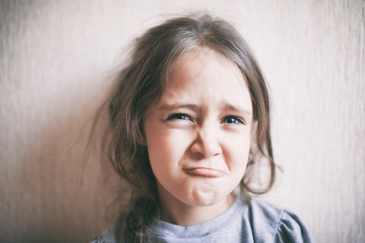 how to stop whining cute young girl grimacing about to cry