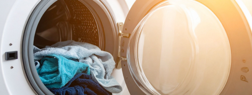 diy laundry helpers dryer door open with blue towels