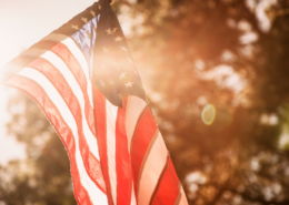memorial day on a budget flag in sunlight golden hour
