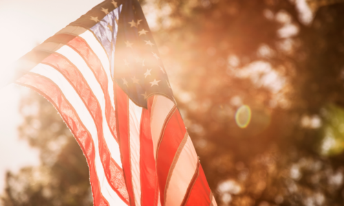 memorial day on a budget flag in sunlight golden hour