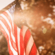 memorial day on a budget flag in sunlight golden hour