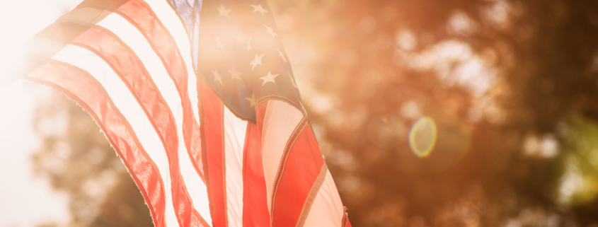memorial day on a budget flag in sunlight golden hour