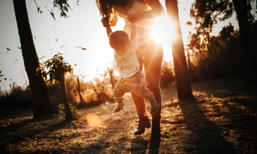 give mom a day off mother and son in park at golden hour sunset