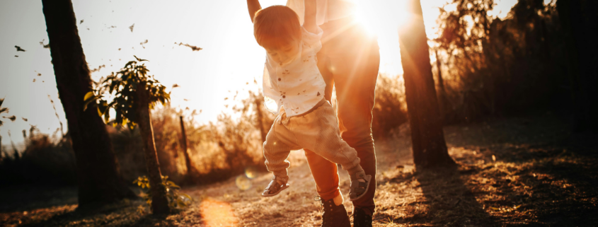 give mom a day off mother and son in park at golden hour sunset
