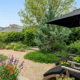 northern colorado home backyard upgrades on a budget two comfortable chairs and patio umbrella for shade