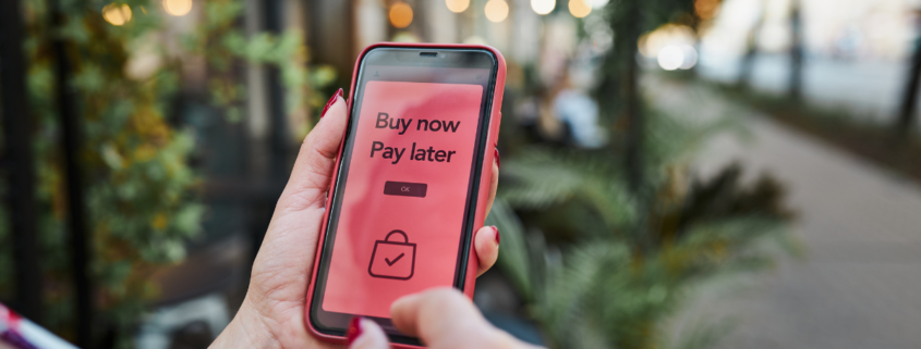 buy now pay later app on iphone in womans hands