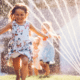 Free Summer Activities for Kids Who Are So Bored little girl running through the sprinklers