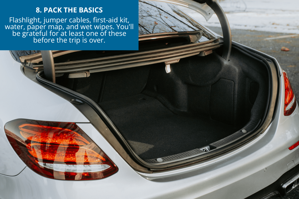emergency preparedness for road trip in summer flashlight jumper cables first aid kit in trunk of car