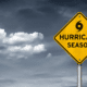 hurricane season prep warning sign with dark cloudy sky in background