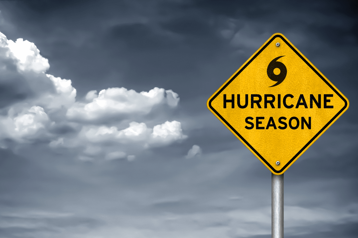 hurricane season prep warning sign with dark cloudy sky in background