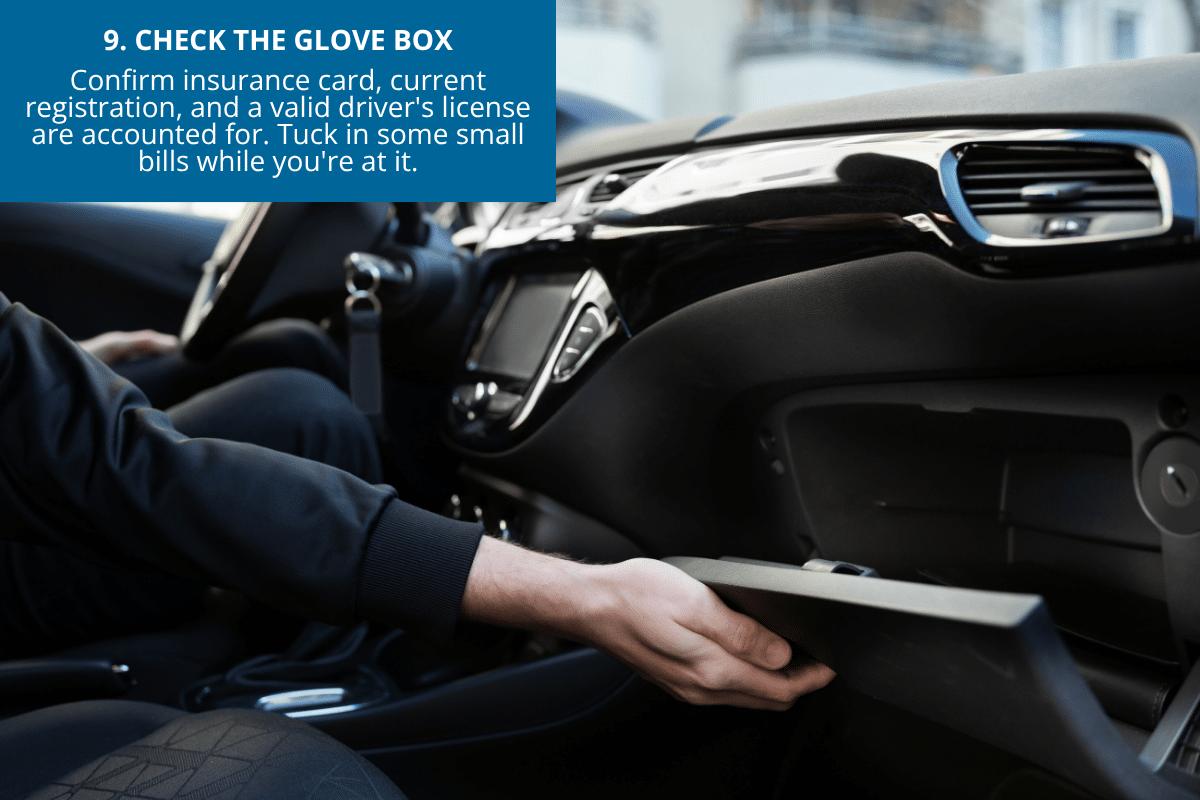 woman checking the glove box for documents in the car before a summer road trip