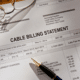 bill glasses and pen how to negotiate your cable and internet bill