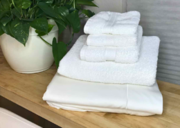 laundry stripping stack of white towels