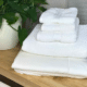 laundry stripping stack of white towels