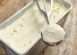 delicious creamy no churn vanilla ice cream scoop and loaf pan
