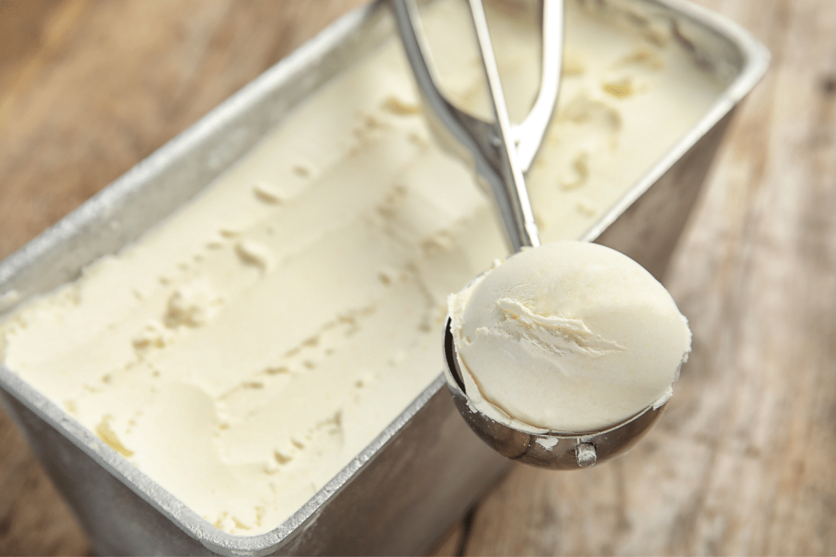 delicious creamy no churn vanilla ice cream scoop and loaf pan