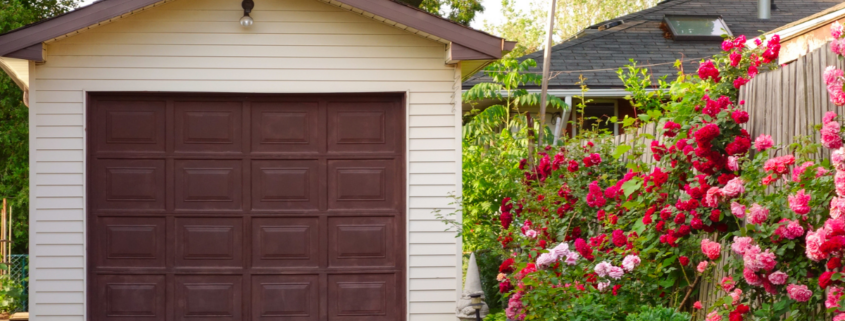 a single car garaged with beautiful flowers along landscape beds things ruined by heat in the garage