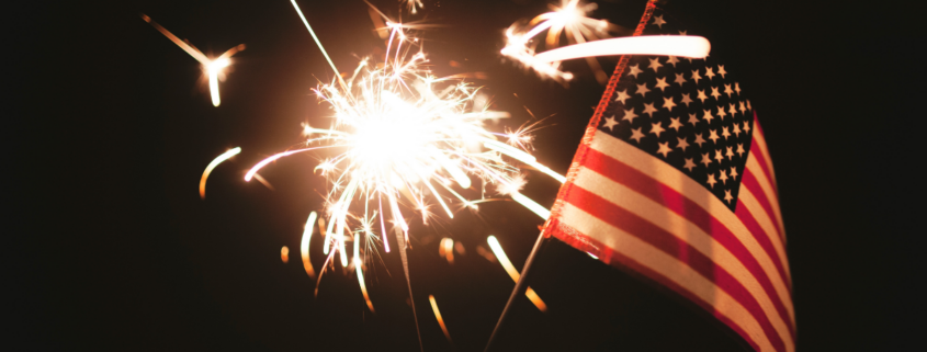 financial independence sparkler and american flag in night sky
