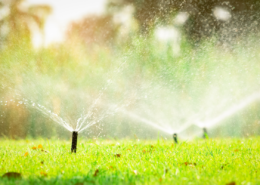 how to read your water bill sprinklers on a residential lawn