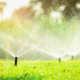 how to read your water bill sprinklers on a residential lawn