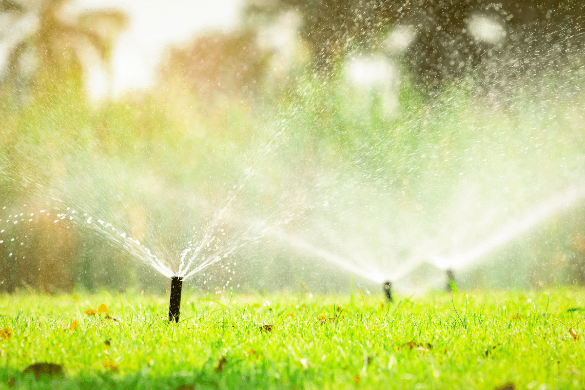 how to read your water bill sprinklers on a residential lawn