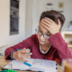 budget homework station young boy studying at kitchen dining table