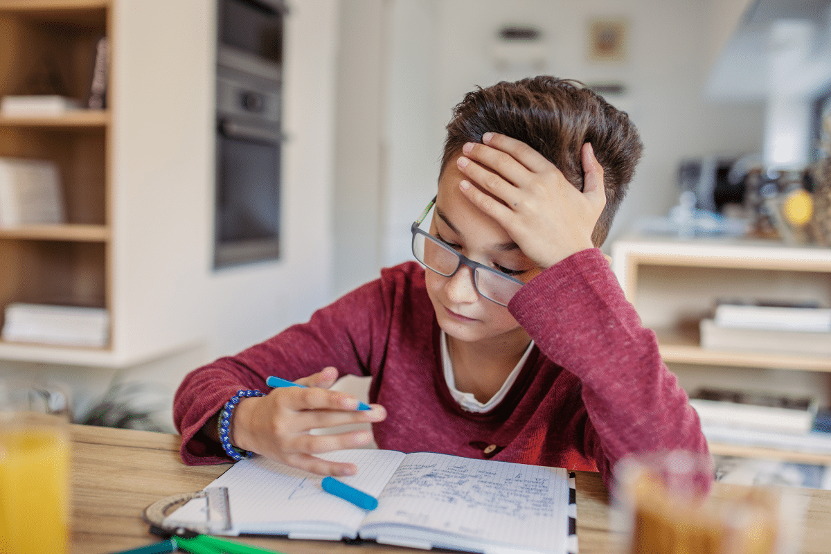 budget homework station young boy studying at kitchen dining table