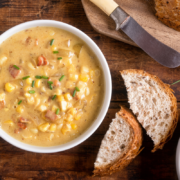 creamy corn chowder with bacon and potatoes with sliced bread