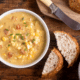 creamy corn chowder with bacon and potatoes with sliced bread